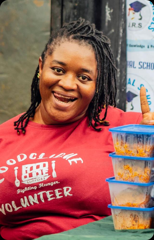 a lady in red tshirt smiling