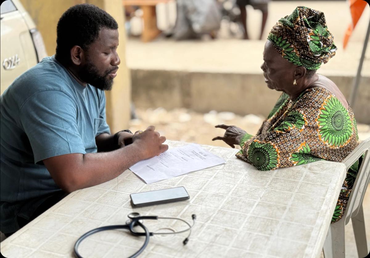 an old woman consulting a male doctor