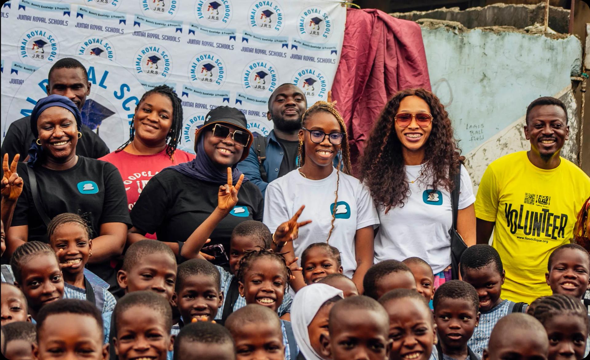 a group of people smiling and posing for a picture