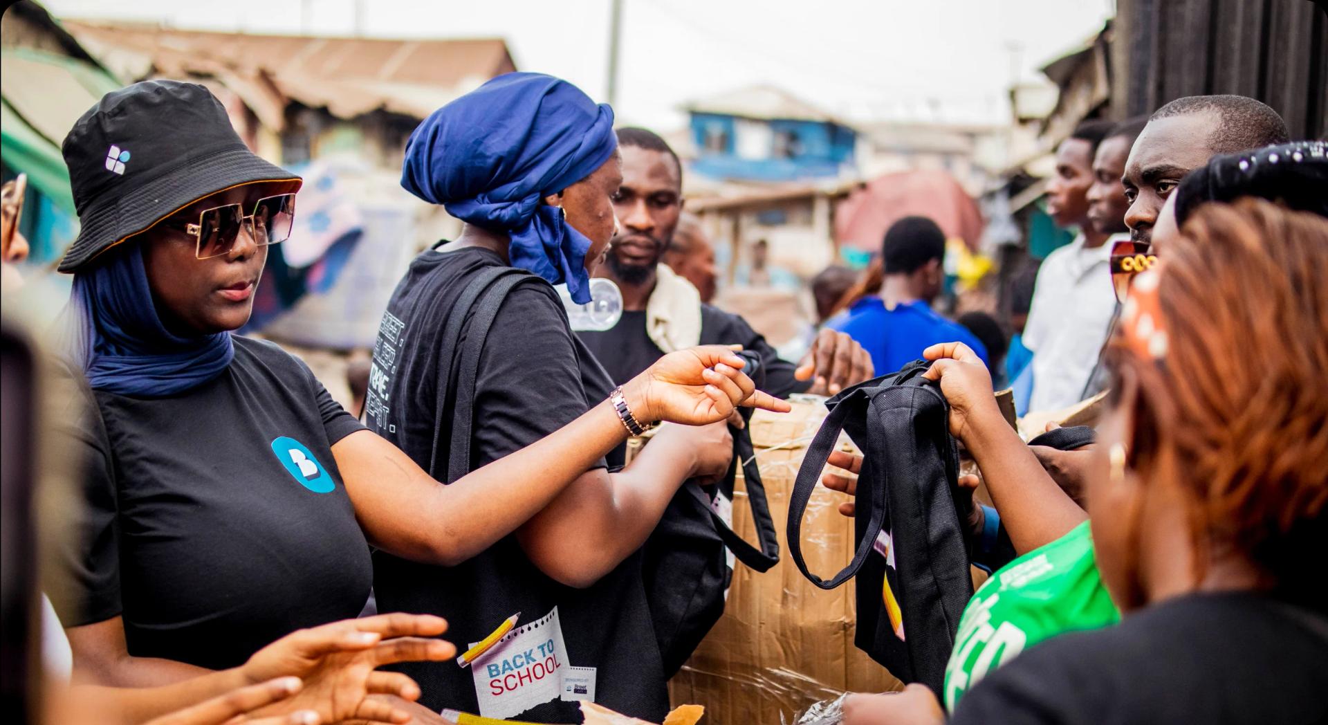 a lady giving instructions to others in a group